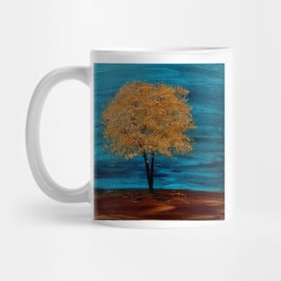 A tree with gold leaves in a storm Mug